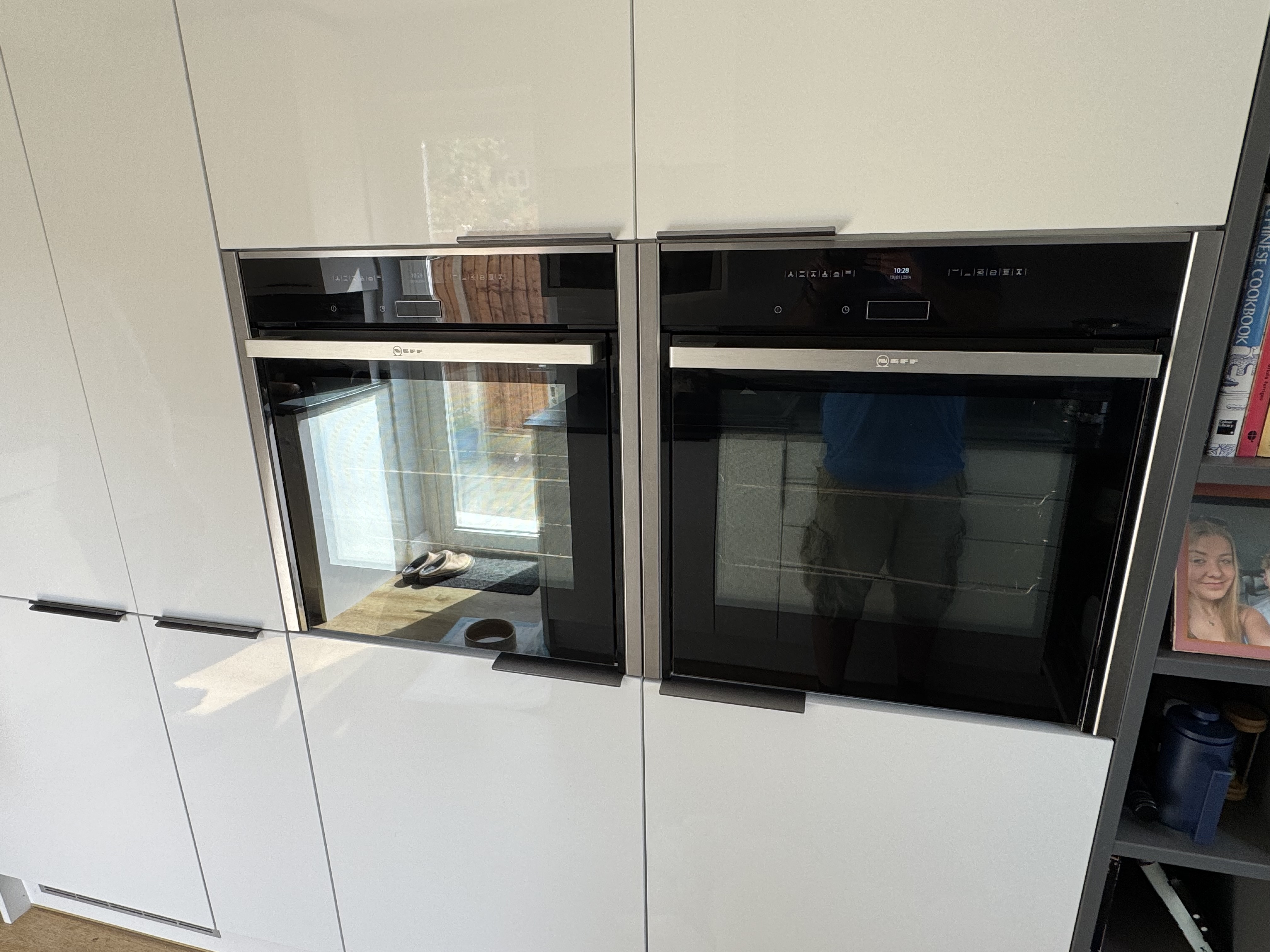 Finished modern kitchen with under-cabinet task lighting and worktop sockets in a Reading home