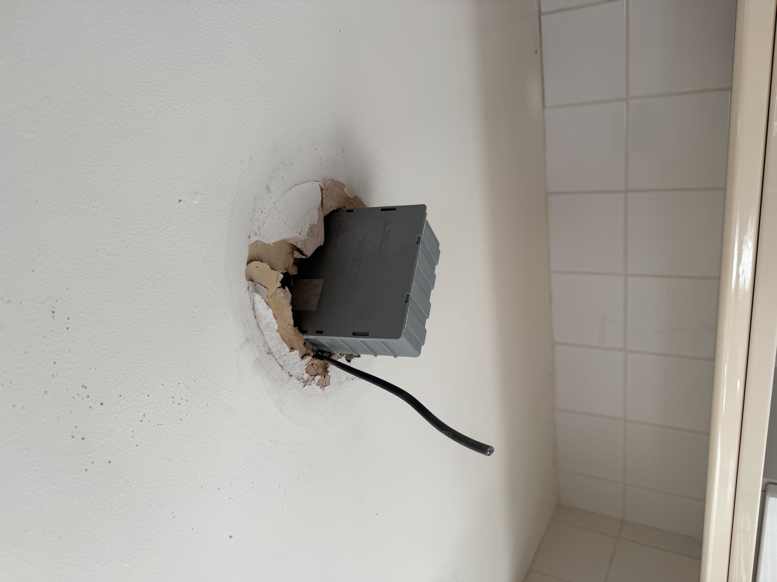 The connections re-made and enclosed in a proper maintenance-free junction box, tucked neatly into the ceiling void